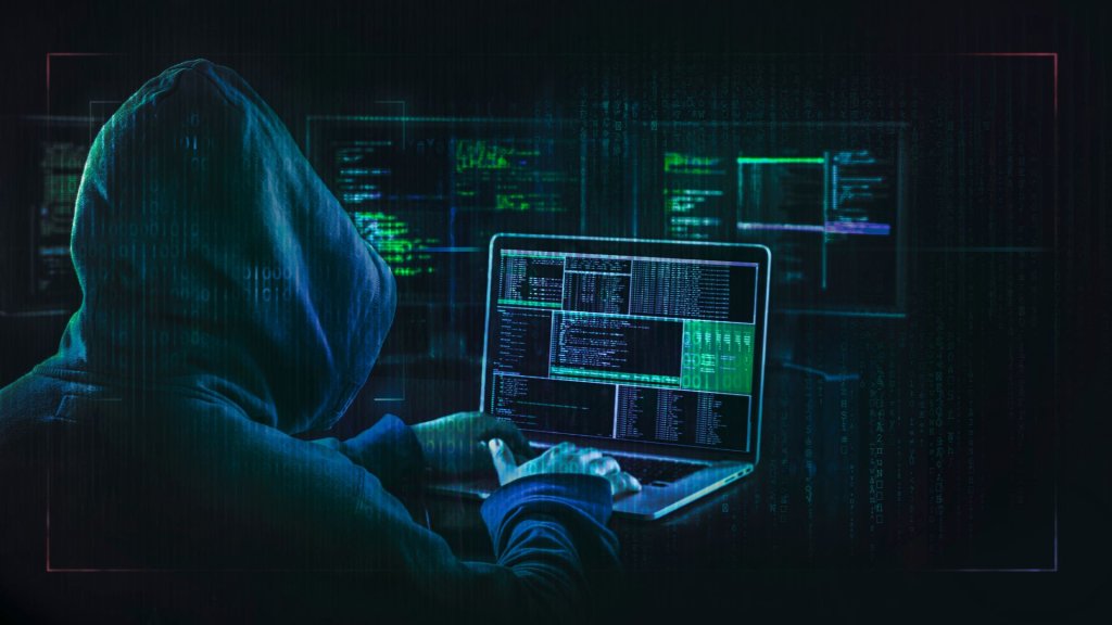 Hacker atacando principais vulnerabilidades de APIs